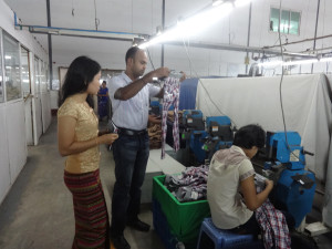 Textile Expert of ESGE, inspecting the finished garments at Cherry II Factory